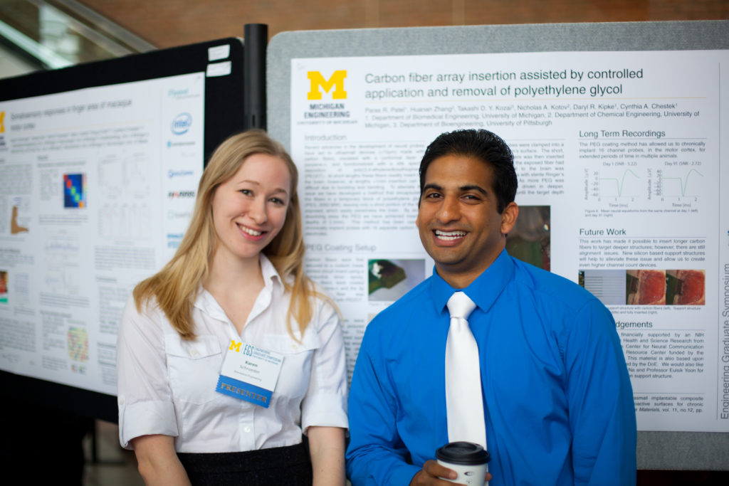 two students presenting research